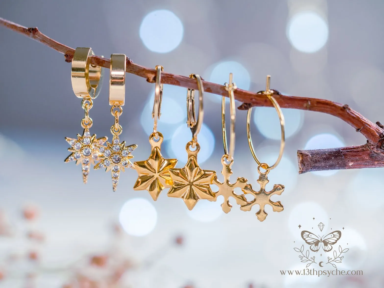 Hypoallergenic gold hoop earrings with snowflake charm