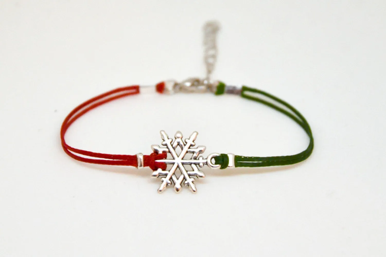 Women bracelet with silver snow flake charm, red and green cords