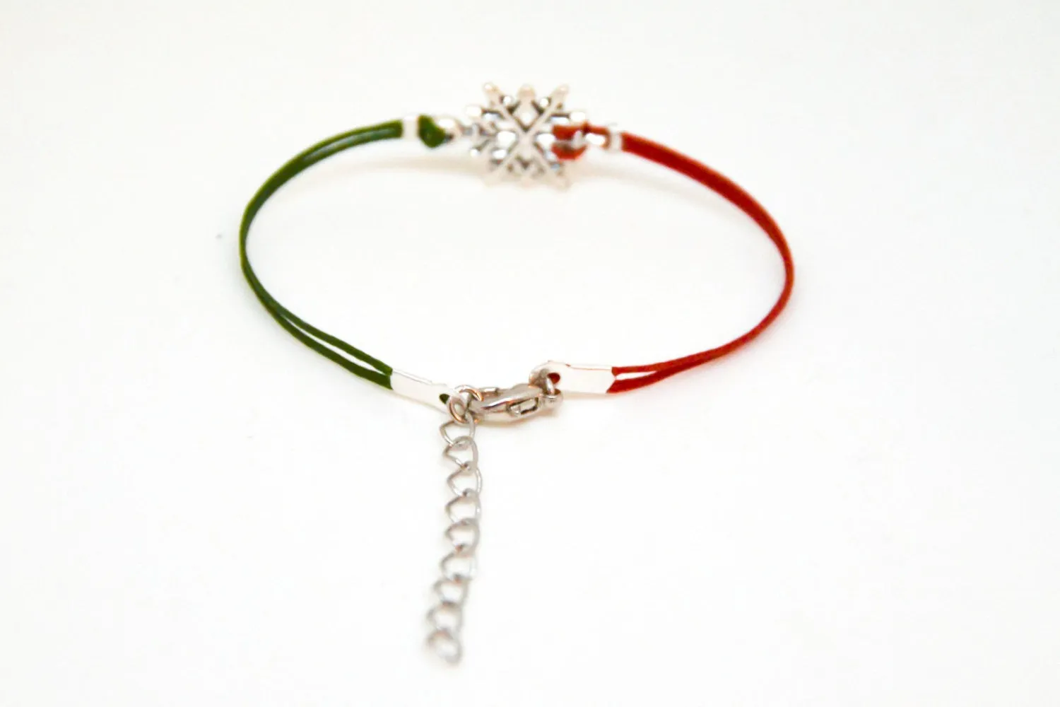 Women bracelet with silver snow flake charm, red and green cords